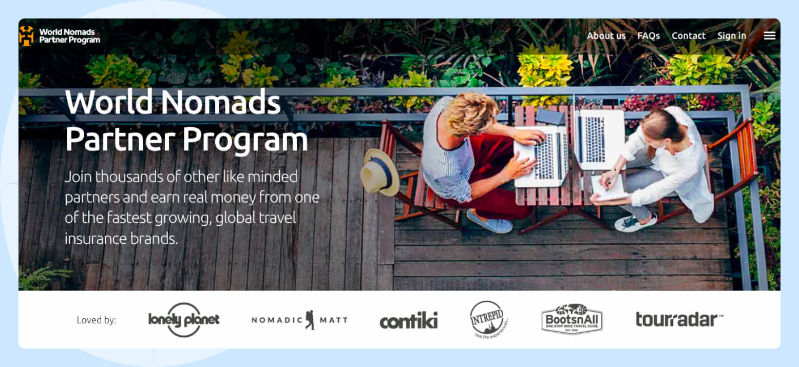 World Nomads Partner Program Screenshot of the World Nomads Partner Program featuring a photo of two people sitting and working on their laptop computers on a deck surrounded by palm trees.