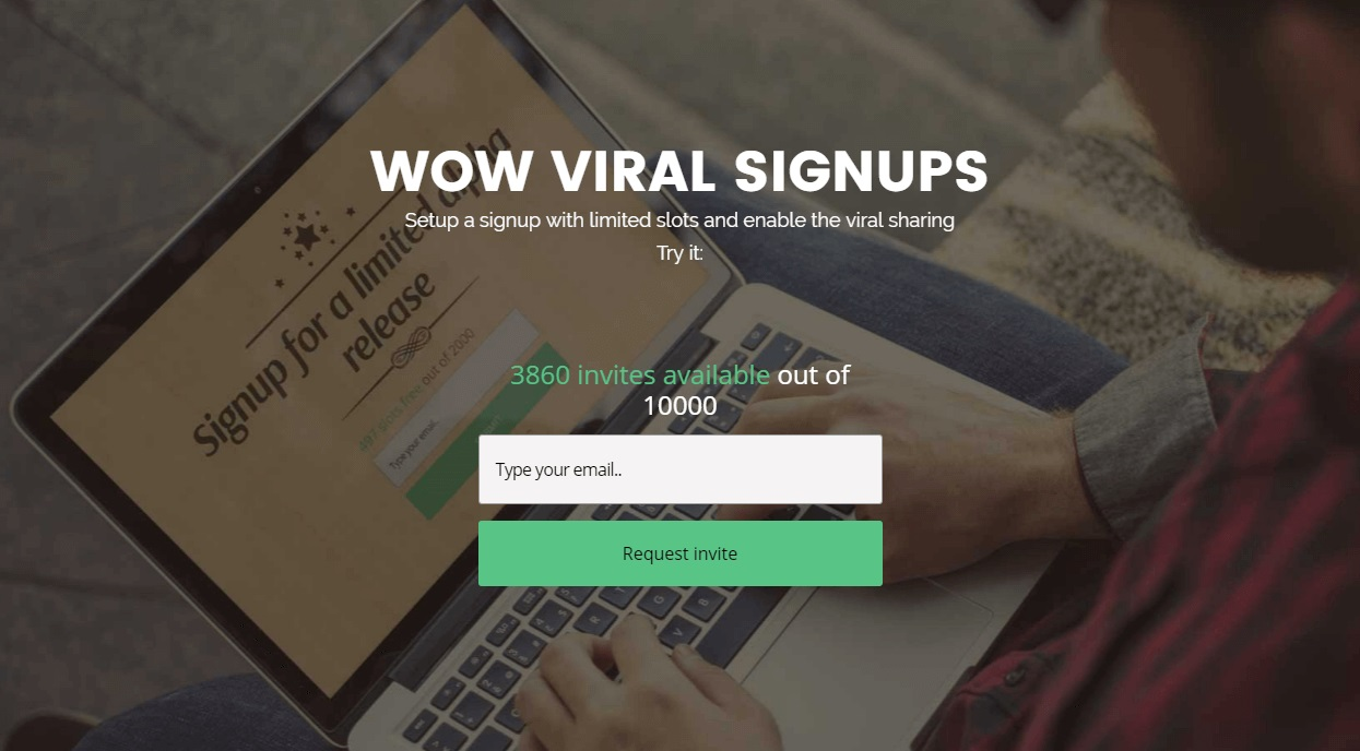 Wow Viral homepage A screenshot of the Wow Viral homepage featuring a signup form and a photo of a person typing on a laptop
