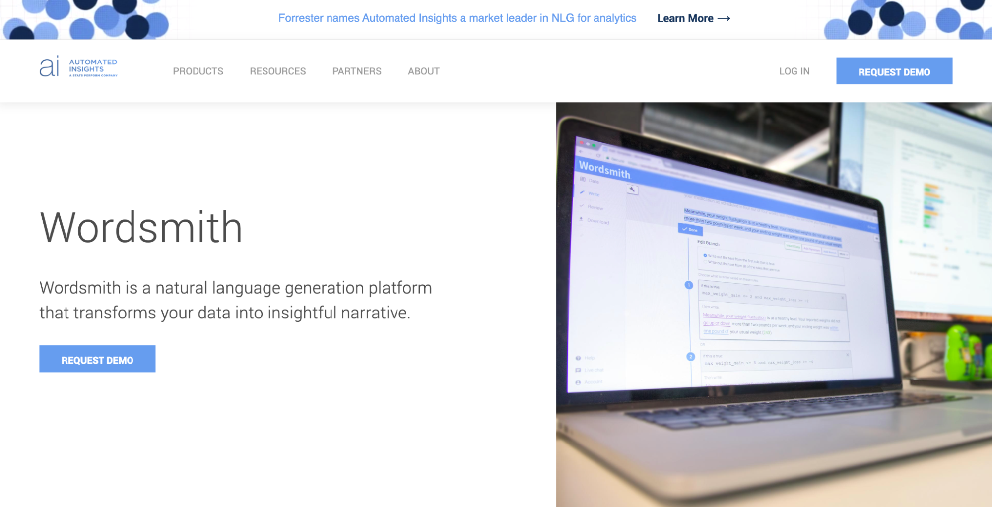 A screenshot of the Wordsmith homepage featuring a photo of a computer displaying the Wordsmith dashboard.