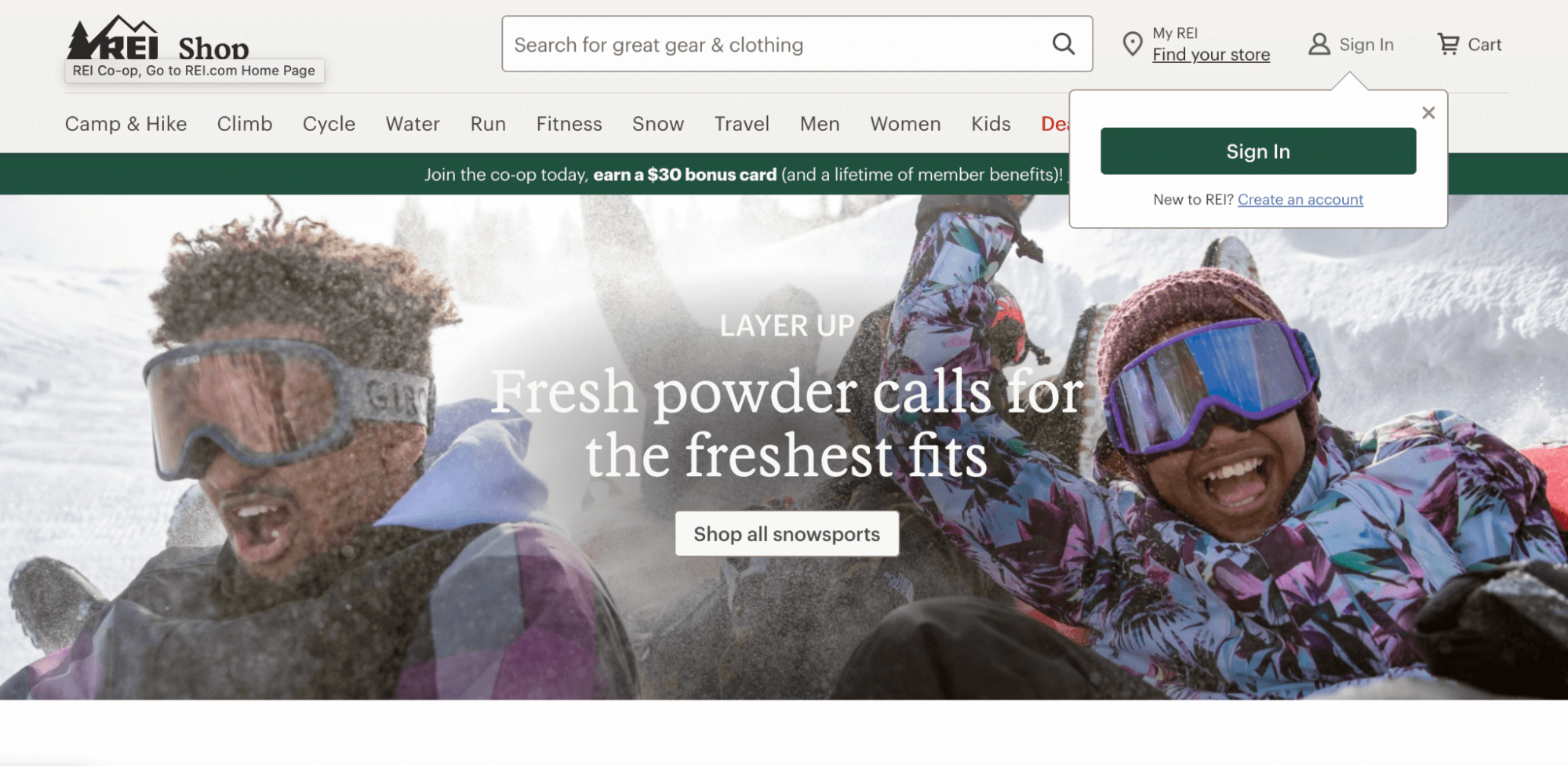 The image displays the homepage of REI with options to choose gear for camping, hiking, cycling, paddle sports, running, and travel. The homepage shows two people enjoying winter activities in the mountains.
