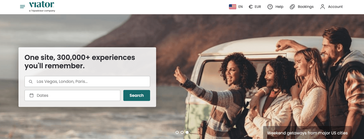 The Viator.com main page Screenshot of the Viator.com main page showing group of joyful people taking a selfie near the car.